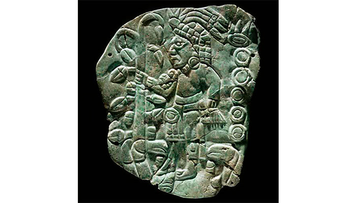 Greenstone tablet depicting lord grasping a cacao tree as a staff Getty Museum